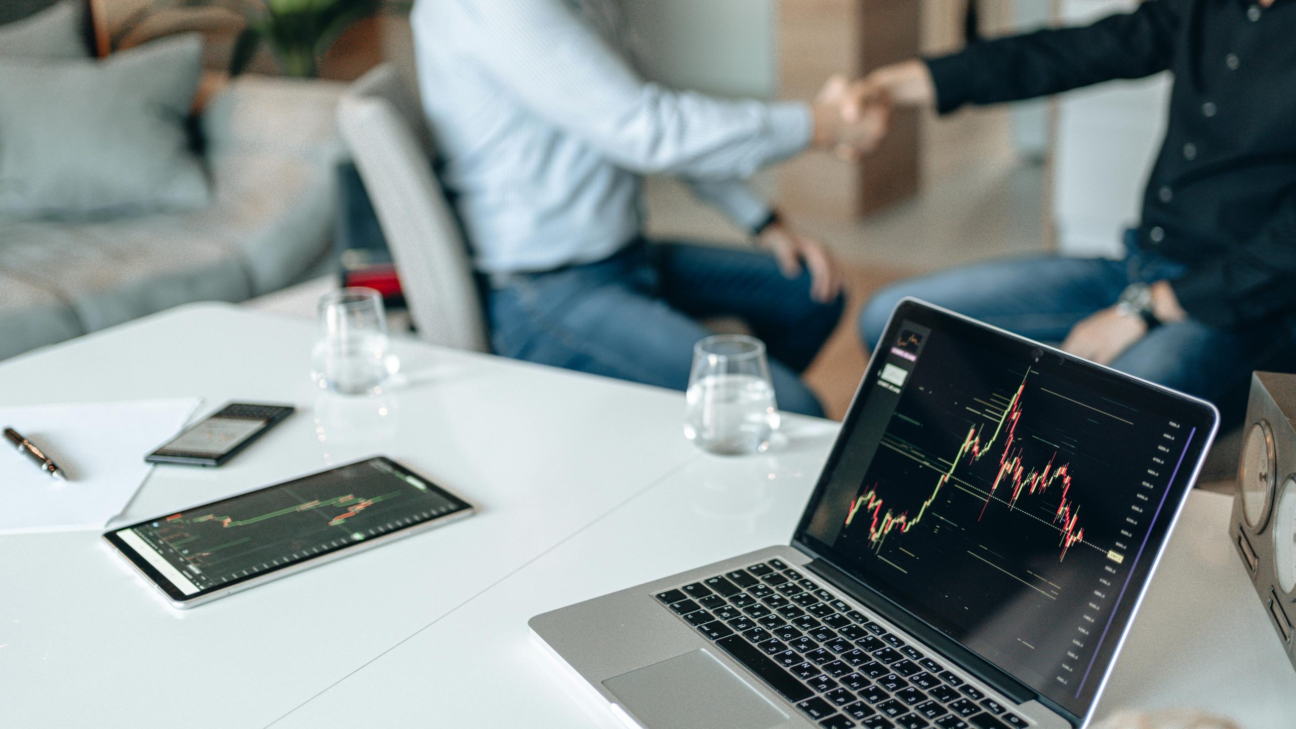 C3.ai office building,stock market trading floor,CEO handshake meeting,artificial intelligence software,financial chart tablet