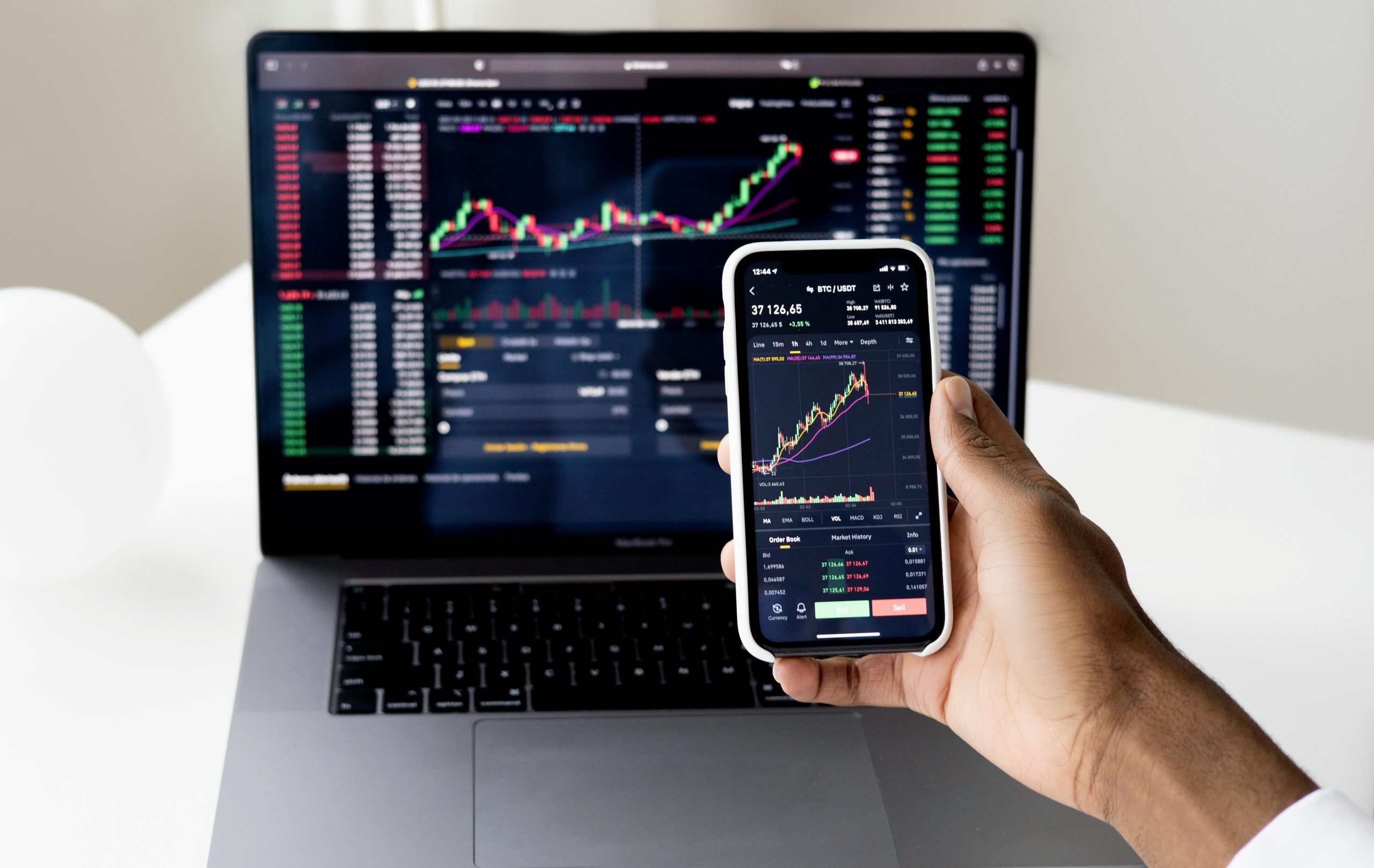 satellite dish,stock trading floor,wireless spectrum chart,SpaceX rocket launch,smartphone screen