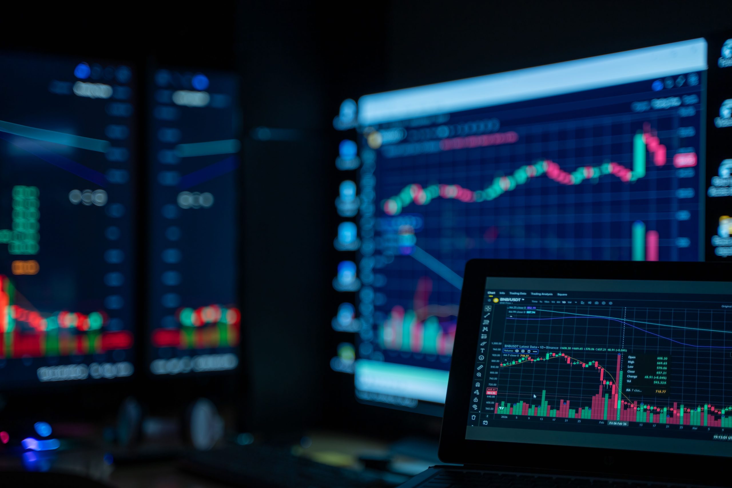stock market chart volatility,forex trading desk screens,trader analyzing multiple monitors,dollar and euro currency pair,Wall Street trading floor